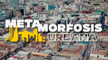 Metamorfosis Urbana y de fondo una foto panoramica de un barrio de Bogotá